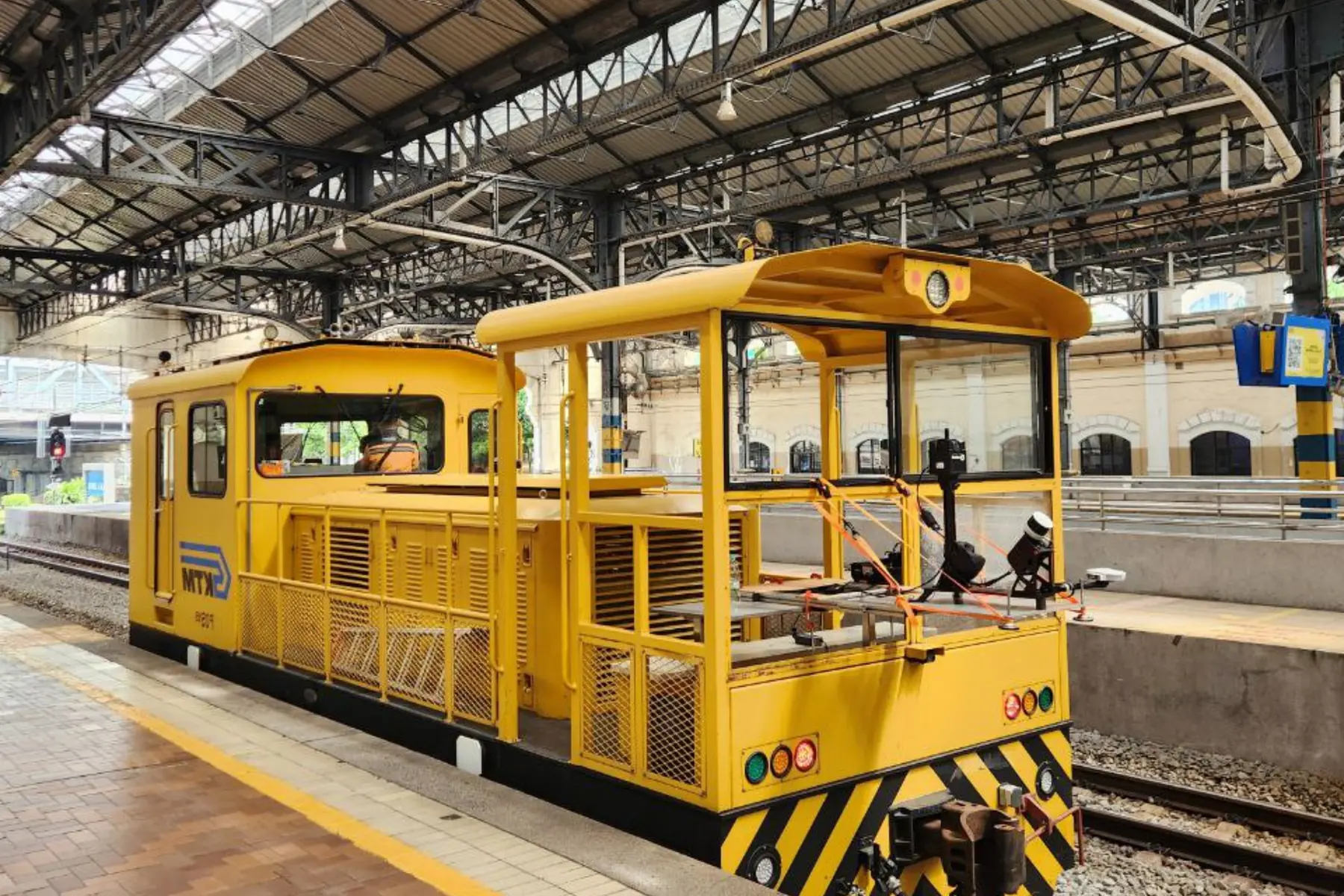 Rail maintenance trolley at a station platform in Malaysia carrying a mast-mounted mobile LiDAR scanner for railway corridor survey